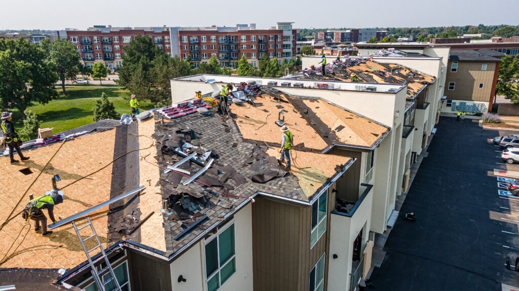 Overhead shot of apartment complex going through roofing repairs in Aurora Colorado