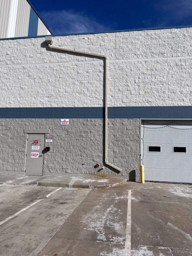 Gutter and drain on a tall warehouse