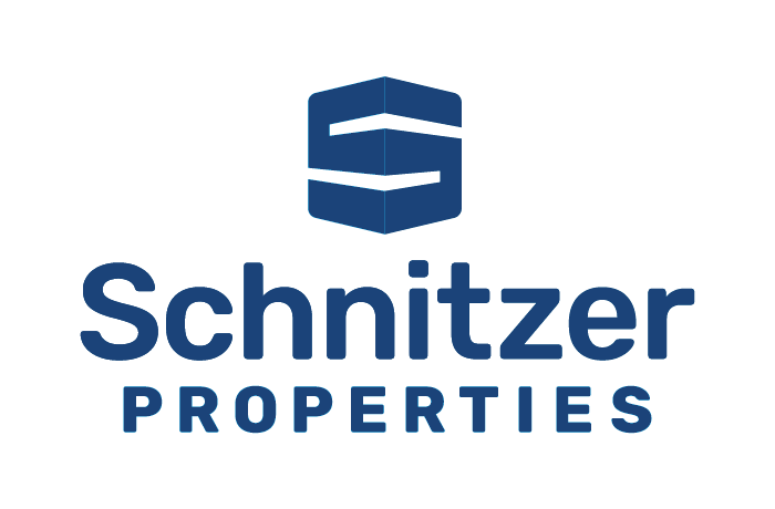 Schnitzer Properties Logo in a navy blue color